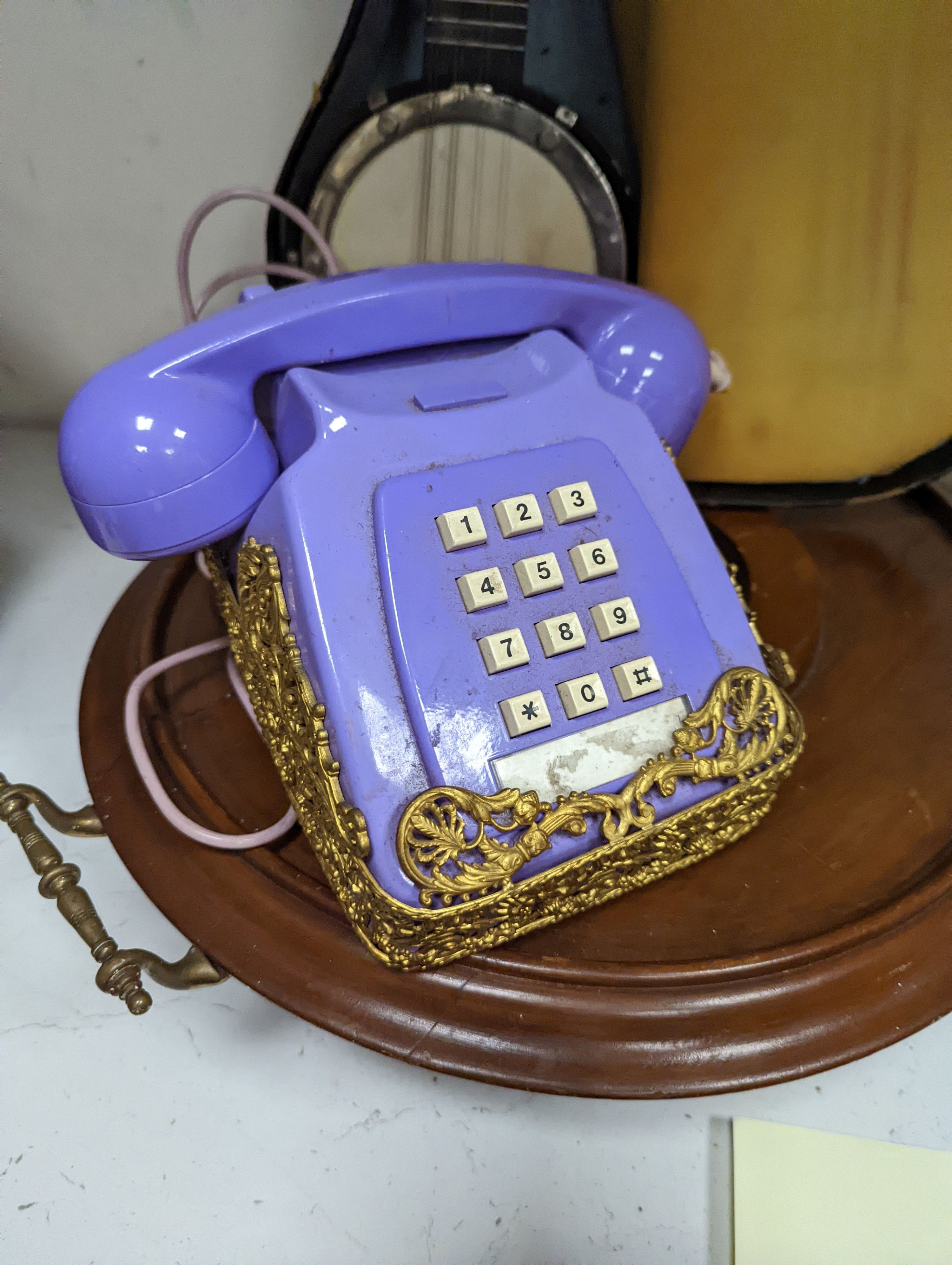 A cased miniature banjo, gilt metal mounted telephone and a mahogany lazy susan (a.f.)